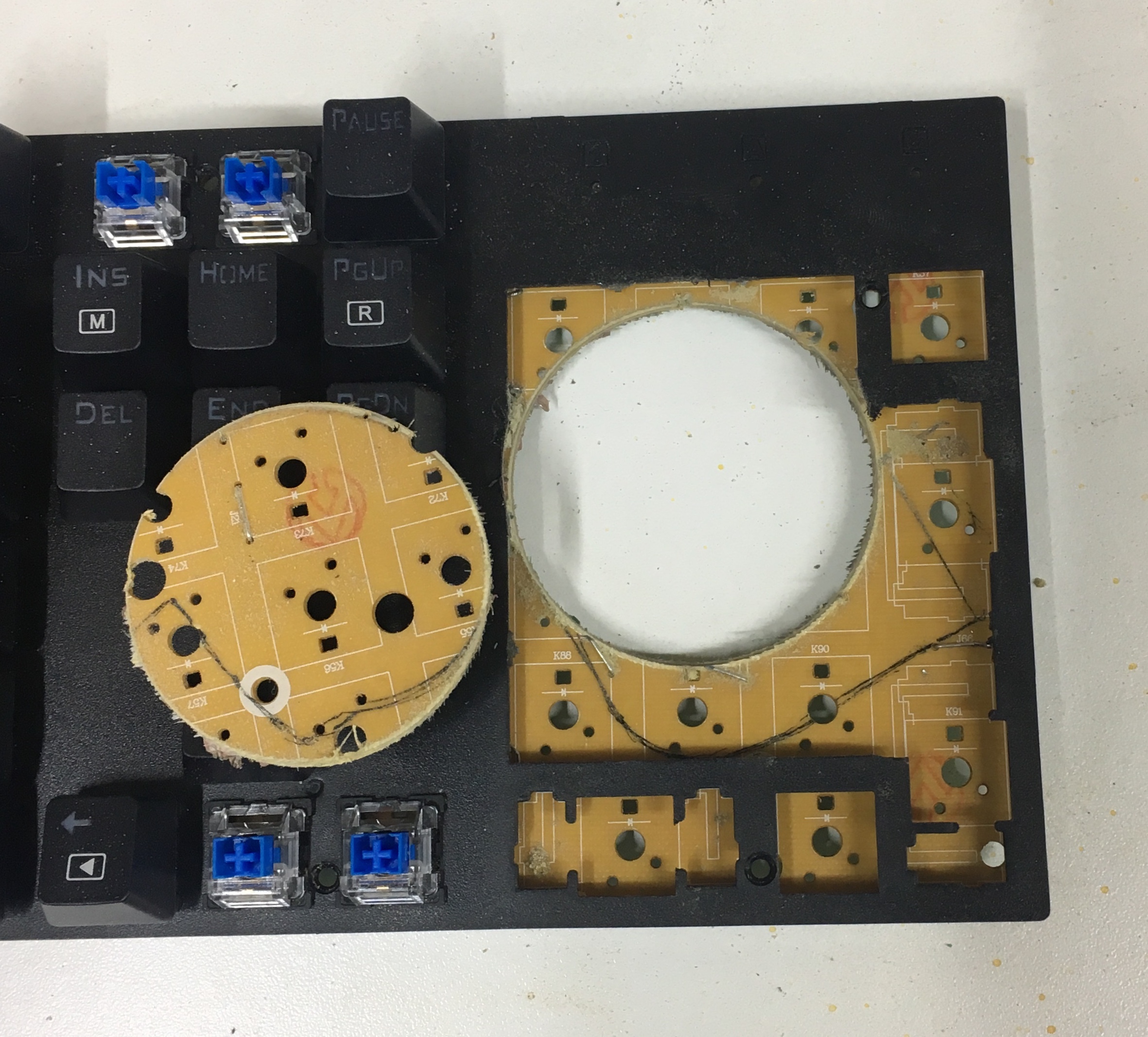 Part of the PCB has been cut out with a hole saw